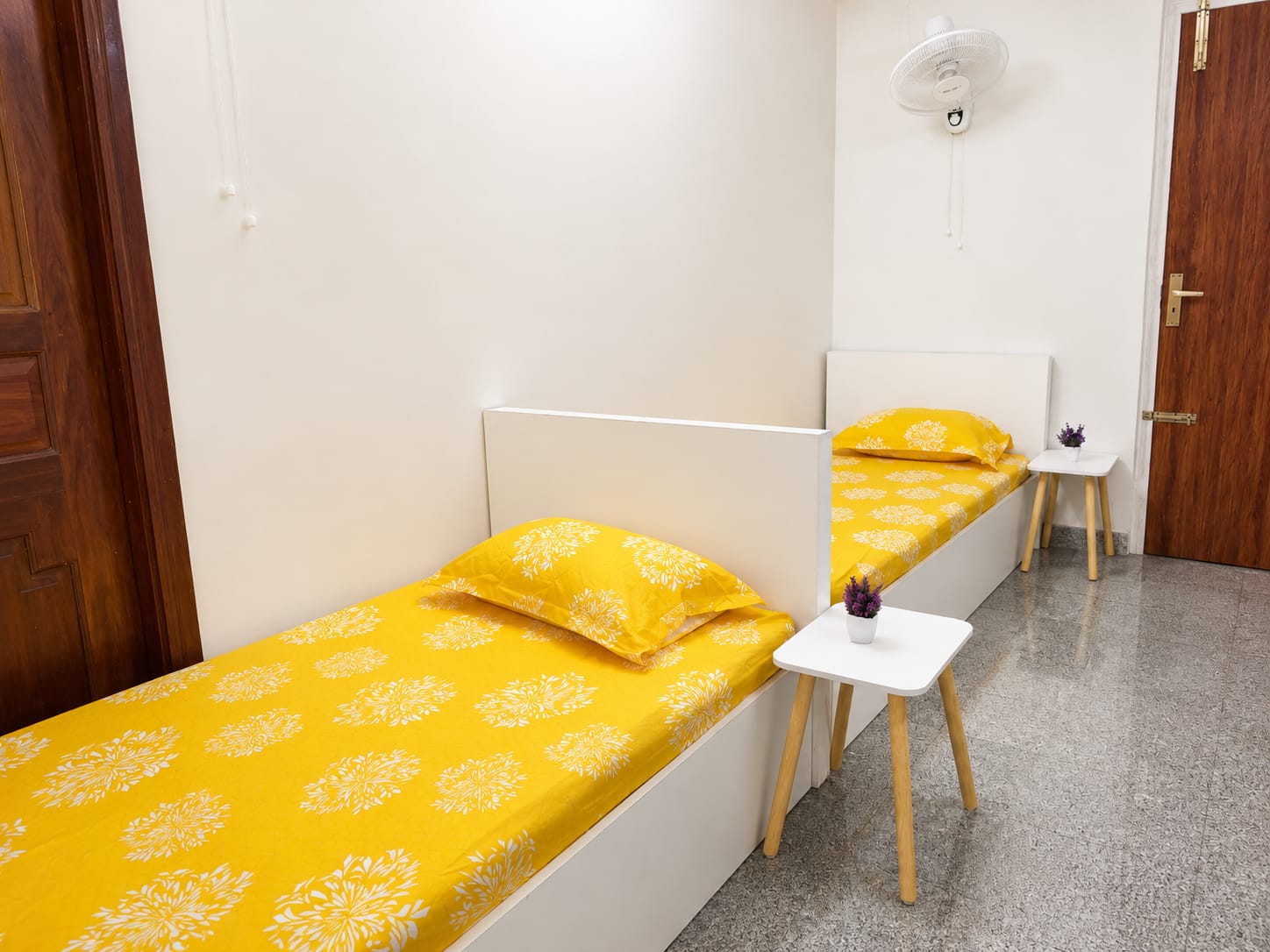 3-sharing room with marigold bedding and bedside tables