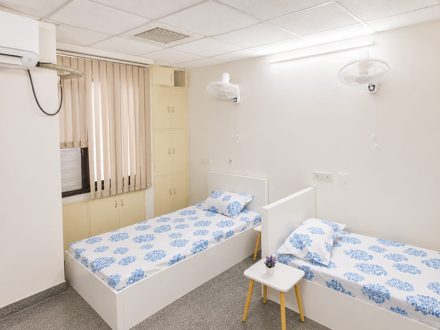 4-sharing room with indigo bedding and split AC